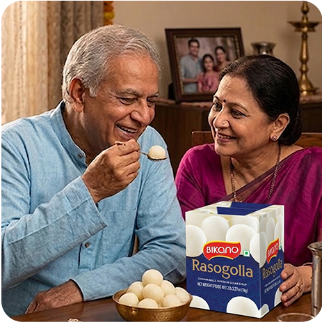 Elderly couple sharing sweets